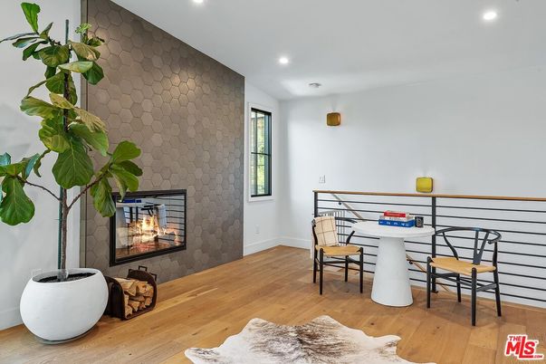 Dining room, Fireplace, Interior, Recessed Lighting, Stone Walls, Wood Texture Flooring