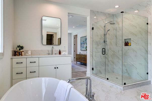 Bathroom, Dual Sink Vanities, Free Standing Baths, Glass Shower, Interior, Marble, Marble Walls, Recessed Lighting