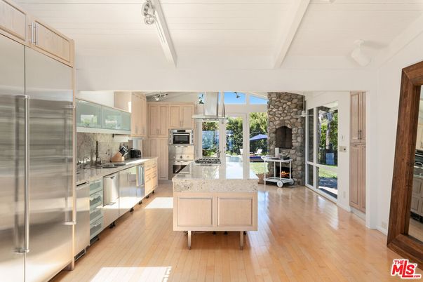 Fireplace, Interior, Kitchen, Stainless Steel Appliances, Stone Walls, Wood Texture Flooring