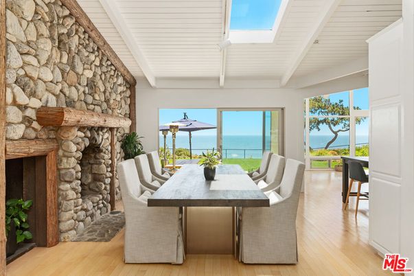 Dining room, Fireplace, Interior, Stone Walls, Water, Wood Texture Flooring