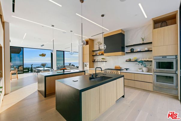 Interior, Kitchen, Marble Walls, Pendant Lights, Recessed Lighting, Stainless Steel Appliances, Water, Wood Texture Flooring