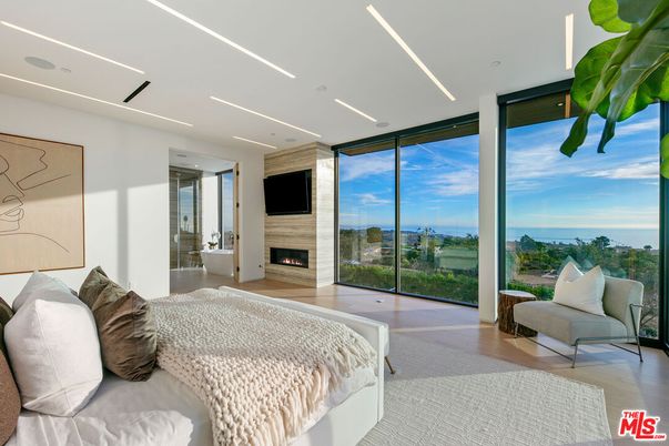 Bedroom, Fireplace, Interior, Recessed Lighting, Water, Wood Texture Flooring