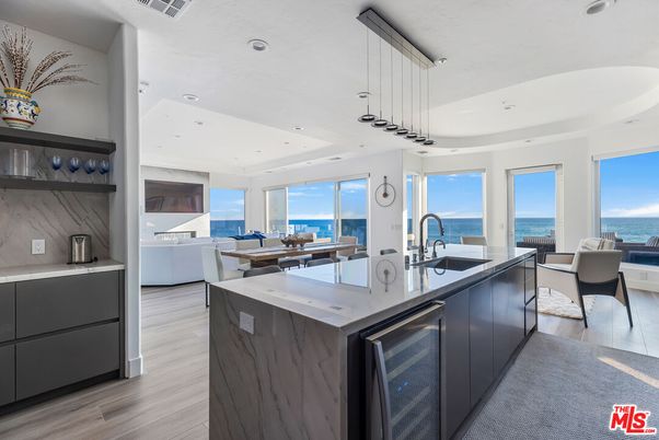 Dining room, Interior, Kitchen, Marble Walls, Pendant Lights, Recessed Lighting, Water, Wood Texture Flooring