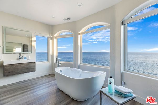 Bathroom, Free Standing Baths, Interior, Recessed Lighting, Water, Wood Texture Flooring