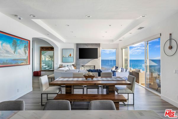 Dining room, Fireplace, Interior, Living room, Recessed Lighting, Water, Wood Texture Flooring