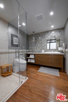 Bathroom, Dual Sink Vanities, Free Standing Baths, Glass Shower, Interior, Recessed Lighting, Wood Texture Flooring