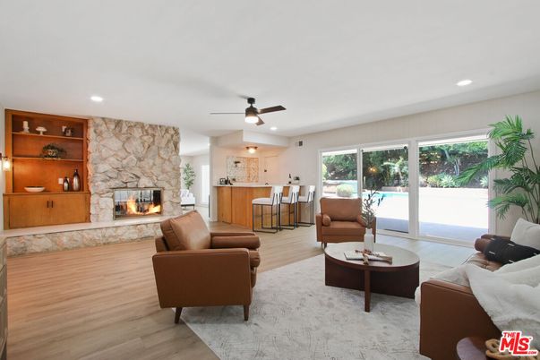 Fireplace, Interior, Living room, Recessed Lighting, Stone Walls, Wood Texture Flooring