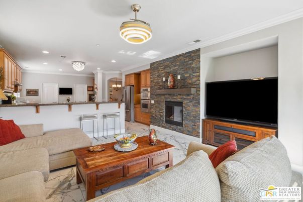 Fireplace, Interior, Kitchen, Living room, Marble, Pendant Lights, Recessed Lighting, Stainless Steel Appliances, Stone Walls