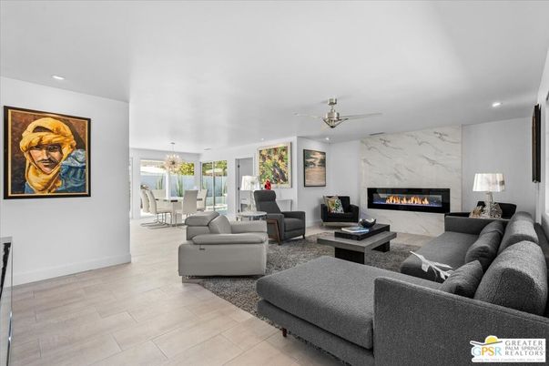 Dining room, Fireplace, Interior, Living room, Marble Walls, Recessed Lighting, Wood Texture Flooring