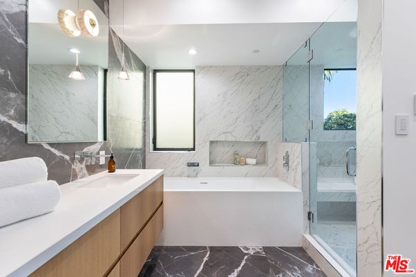 Bathroom, Dual Sink Vanities, Glass Shower, Interior, Marble, Marble Walls, Recessed Lighting