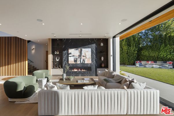 Fireplace, Interior, Living room, Marble Walls, Recessed Lighting, Wood Texture Flooring