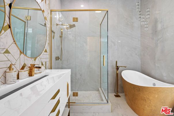 Bathroom, Dual Sink Vanities, Free Standing Baths, Glass Shower, Interior, Marble, Marble Walls, Recessed Lighting