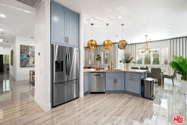 Dining room, Interior, Kitchen, Pendant Lights, Recessed Lighting, Stainless Steel Appliances, Wood Texture Flooring