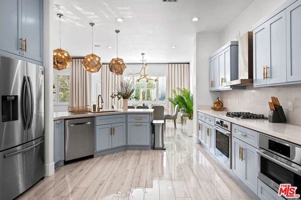 Dining room, Interior, Kitchen, Marble, Pendant Lights, Recessed Lighting, Stainless Steel Appliances, Wood Texture Flooring