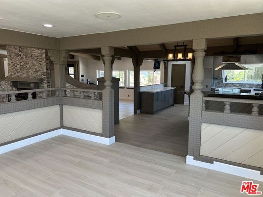 Chandelier, Fireplace, Interior, Kitchen, Pendant Lights, Recessed Lighting, Stone Walls, Wood Texture Flooring