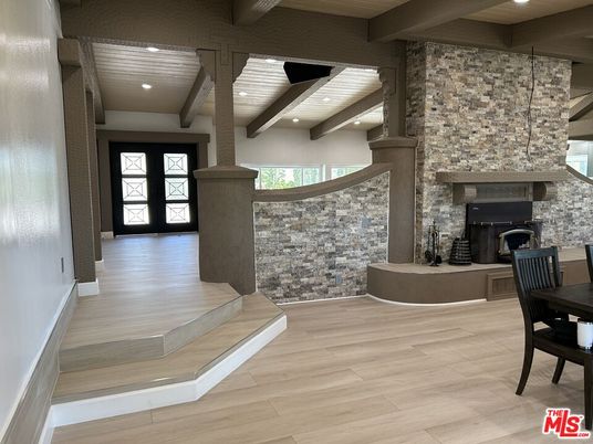 Fireplace, Interior, Pendant Lights, Recessed Lighting, Stone Walls, Wood Texture Flooring