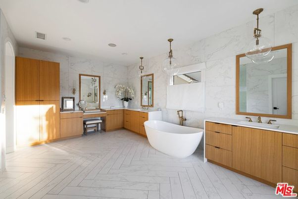 Bathroom, Dual Sink Vanities, Free Standing Baths, Interior, Marble, Marble Walls, Pendant Lights, Recessed Lighting
