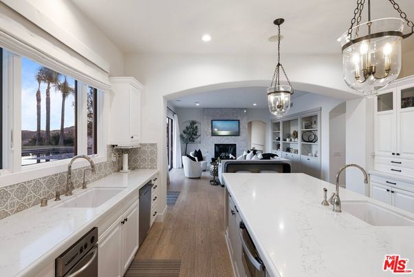 Fireplace, Interior, Kitchen, Living room, Pendant Lights, Recessed Lighting, Stainless Steel Appliances, Wood Texture Flooring