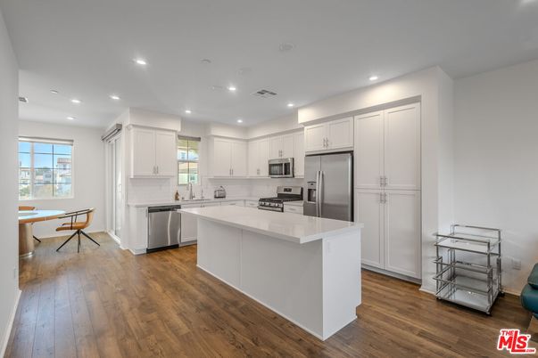 Dining room, Interior, Kitchen, Recessed Lighting, Stainless Steel Appliances, Wood Texture Flooring