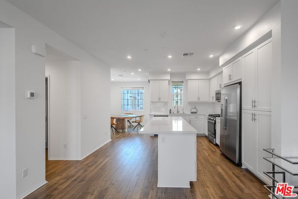 Dining room, Interior, Kitchen, Recessed Lighting, Stainless Steel Appliances, Wood Texture Flooring