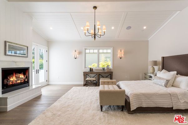 Bedroom, Chandelier, Fireplace, Interior, Recessed Lighting, Wood Texture Flooring