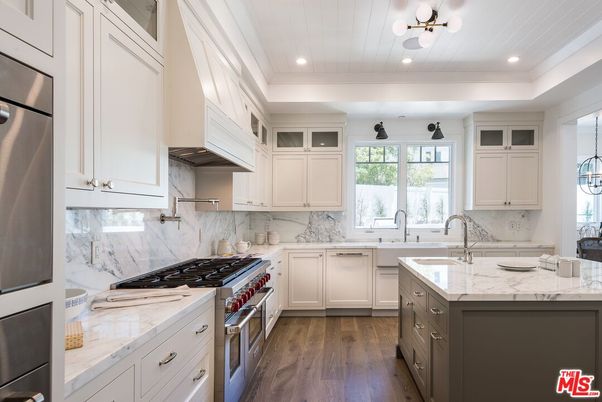 Interior, Kitchen, Marble Walls, Recessed Lighting, Stainless Steel Appliances, Wood Texture Flooring