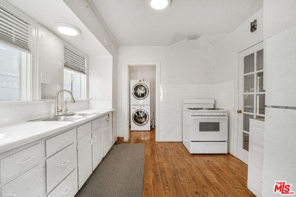Interior, Kitchen, Recessed Lighting, Washer, Wood Texture Flooring