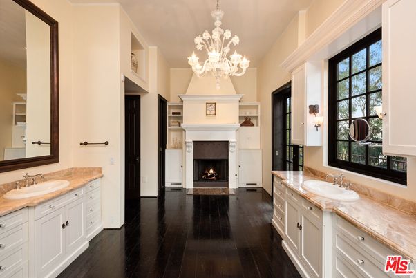 Bathroom, Chandelier, Dual Sink Vanities, Fireplace, Interior, Wood Texture Flooring