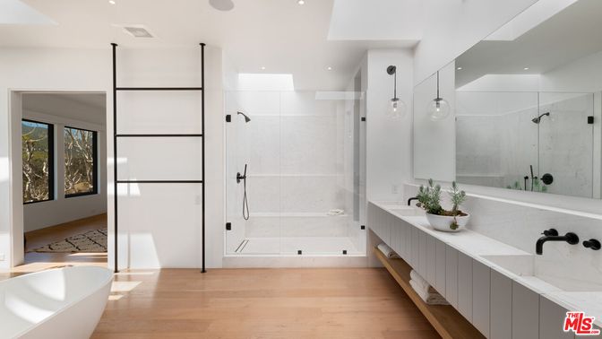 Bathroom, Free Standing Baths, Glass Shower, Interior, Marble Walls, Pendant Lights, Recessed Lighting, Wood Texture Flooring