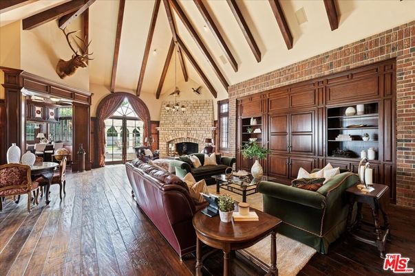 Chandelier, Dining room, Fireplace, Interior, Living room, Stone Walls, Wooden Beams, Wood Texture Flooring