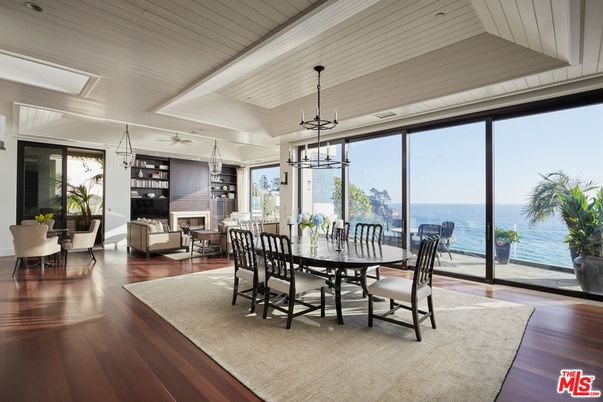 Dining room, Fireplace, Interior, Living room, Pendant Lights, Water, Wood Texture Flooring