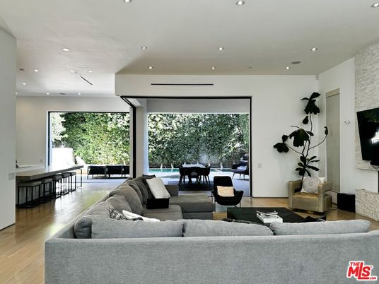 Dining room, Fireplace, Interior, Living room, Recessed Lighting, Wood Texture Flooring