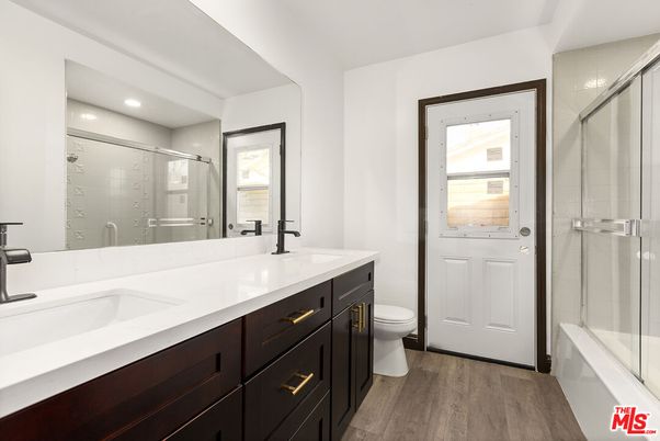 Bathroom, Dual Sink Vanities, Glass Shower, Interior, Recessed Lighting, Wood Texture Flooring