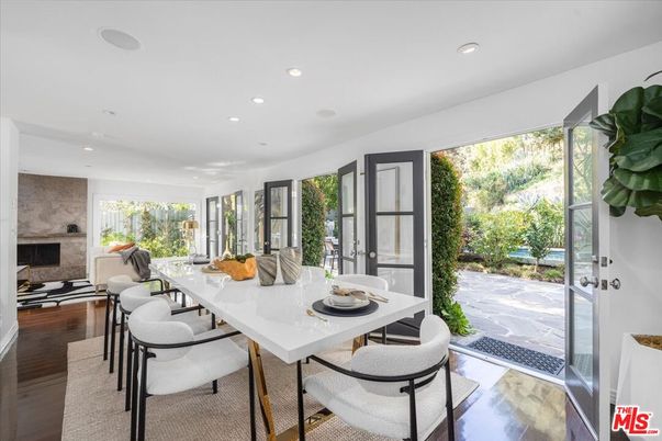 Dining room, Fireplace, Interior, Recessed Lighting, Stone Walls, Wood Texture Flooring