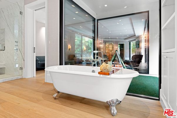 Bathroom, Free Standing Baths, Glass Shower, Interior, Marble Walls, Recessed Lighting, Wood Texture Flooring