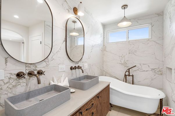 Bathroom, Dual Sink Vanities, Free Standing Baths, Interior, Marble Walls, Pendant Lights, Recessed Lighting