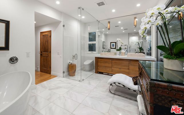 Bathroom, Dual Sink Vanities, Free Standing Baths, Glass Shower, Interior, Marble, Recessed Lighting, Wood Texture Flooring