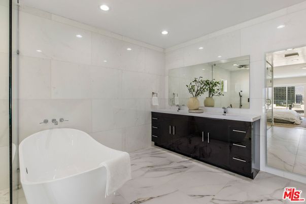 Bathroom, Dual Sink Vanities, Free Standing Baths, Glass Shower, Interior, Marble, Marble Walls, Recessed Lighting
