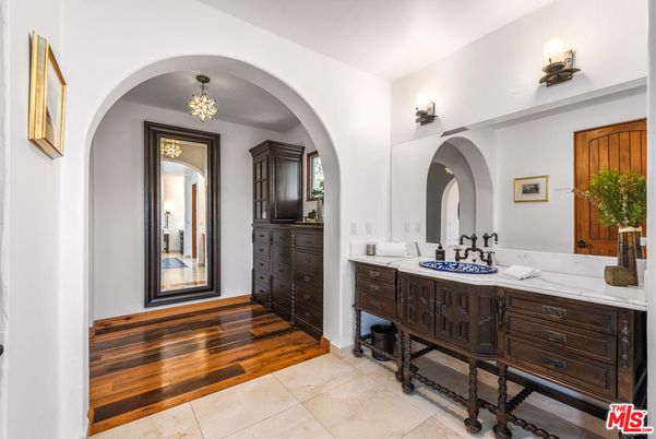Bathroom, Chandelier, Dual Sink Vanities, Interior, Wood Texture Flooring
