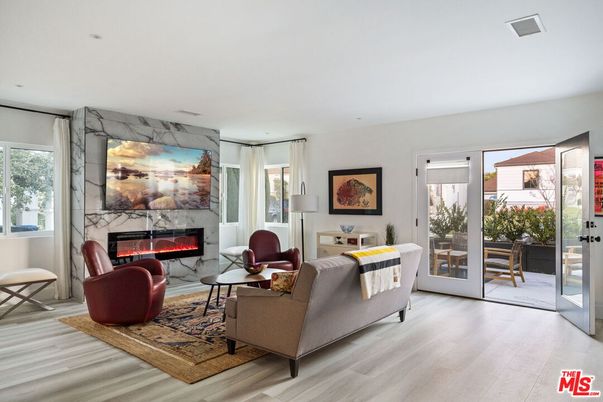 Fireplace, Interior, Living room, Marble Walls, Recessed Lighting, Wood Texture Flooring