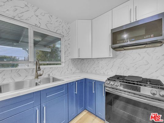 Interior, Kitchen, Marble Walls, Stainless Steel Appliances, Wood Texture Flooring