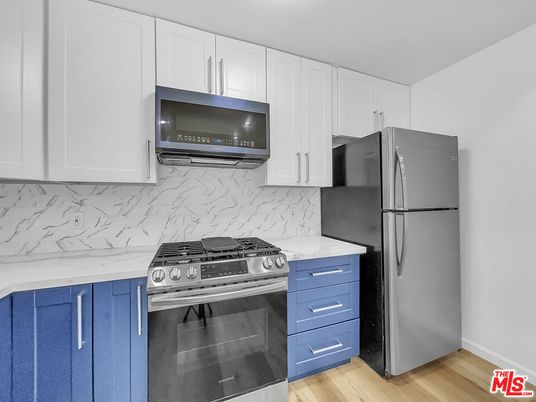Interior, Kitchen, Marble Walls, Stainless Steel Appliances, Wood Texture Flooring