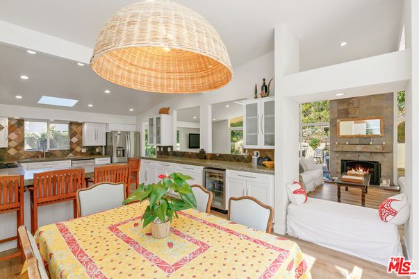 Dining room, Fireplace, Interior, Kitchen, Living room, Recessed Lighting, Stainless Steel Appliances, Wood Texture Flooring