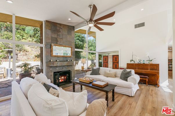 Fireplace, Interior, Living room, Piano, Recessed Lighting, Stone Walls, Wood Texture Flooring
