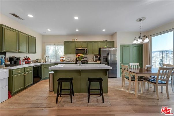 Dining room, Interior, Kitchen, Pendant Lights, Recessed Lighting, Stainless Steel Appliances, Wood Texture Flooring