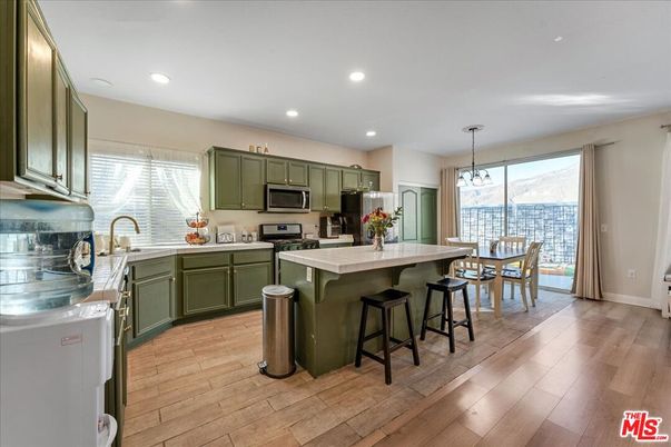 Dining room, Interior, Kitchen, Pendant Lights, Recessed Lighting, Stainless Steel Appliances, Wood Texture Flooring