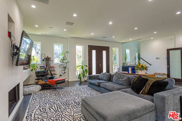 Fireplace, Fitness Equipment, Interior, Living room, Recessed Lighting, Wood Texture Flooring