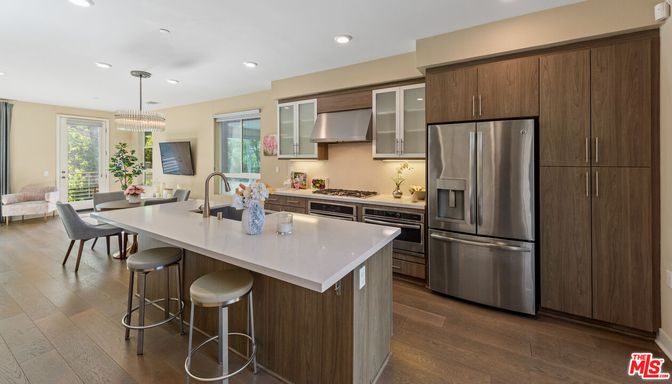 Chandelier, Dining room, Interior, Kitchen, Pendant Lights, Recessed Lighting, Stainless Steel Appliances, Wood Texture Flooring