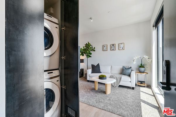 Interior, Living room, Utility Closets, Washer, Wood Texture Flooring