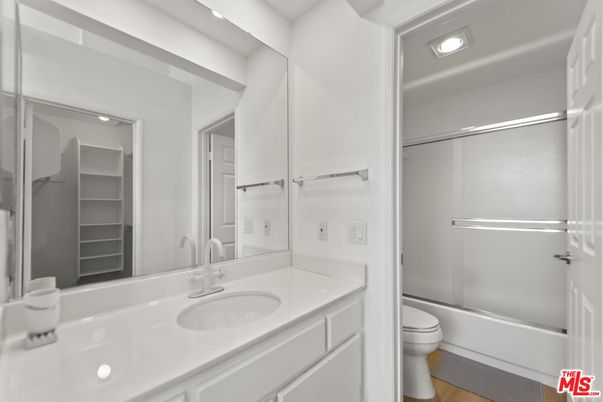 Bathroom, Dual Sink Vanities, Glass Shower, Interior, Recessed Lighting, Walk-in Closets, Wood Texture Flooring